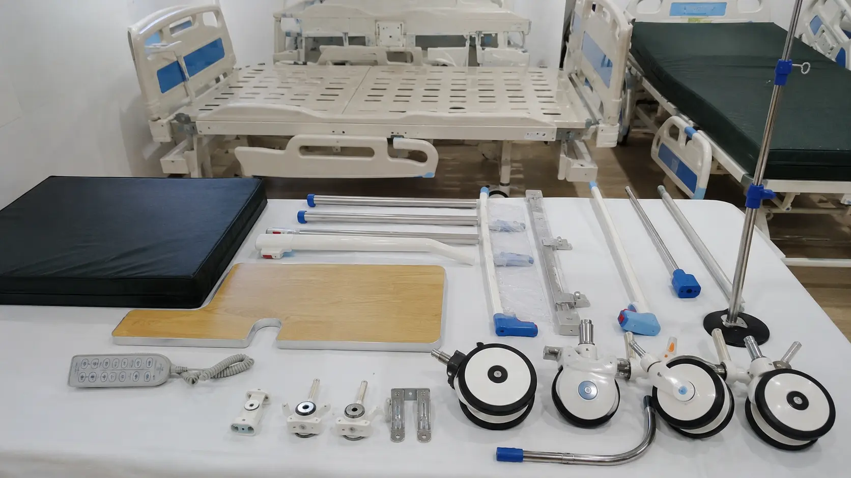 Hospital bed accessories including rails casters mattress and IV pole